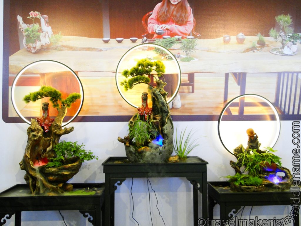 Three natural landscape style decorations on display.