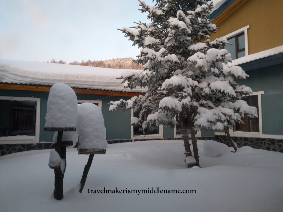 The courtyard of a hotel shows how deep the snow has become.