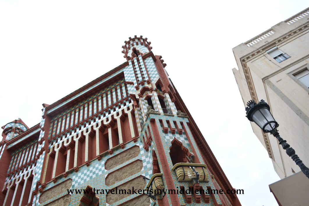 Colourful brick facade of the Casa Vicens seen from the street in Barcelona, Spain