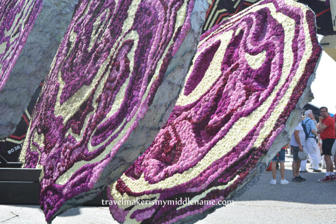 Close up of slices of purple cabbage shaped parade floats.