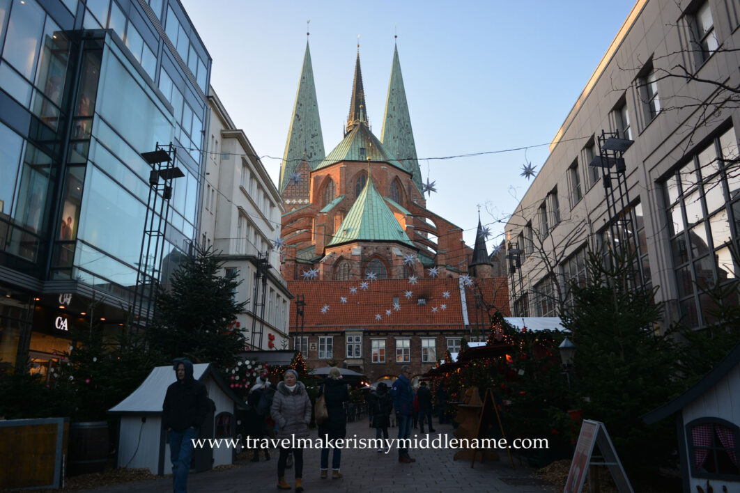 Christmas market stalls in Lübeck with the Marien church in the background