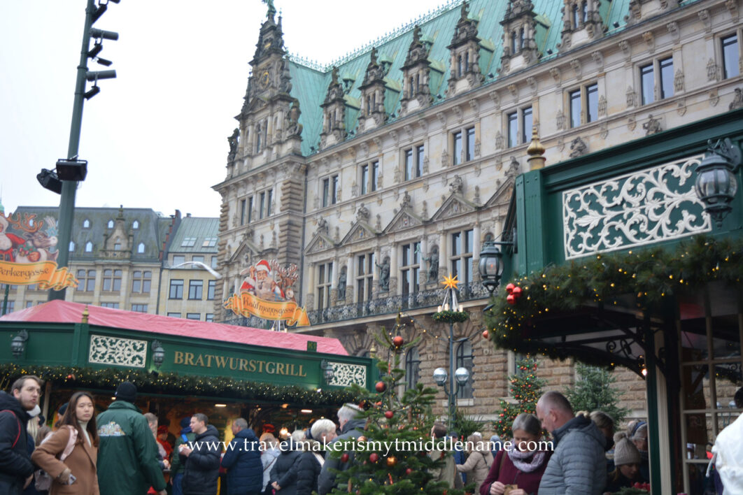 The Rahaus Christmas market in Hamburg with the green roofed Rathous in the background