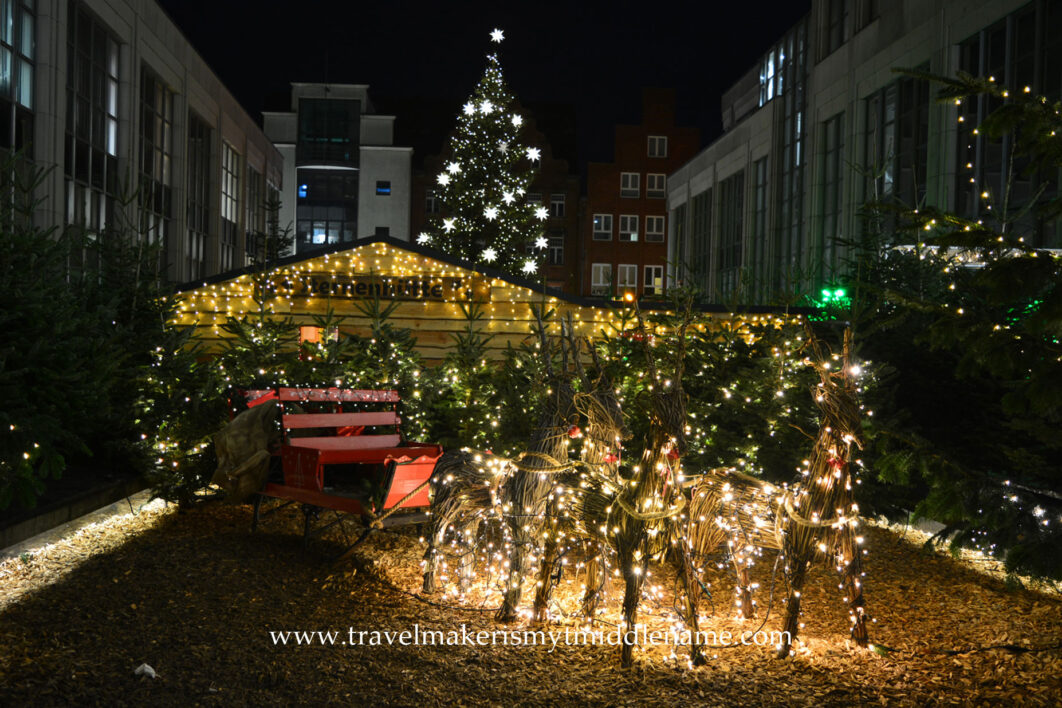 An empty sleigh and light up wire reindeers in a Christmas market in Lübeck 