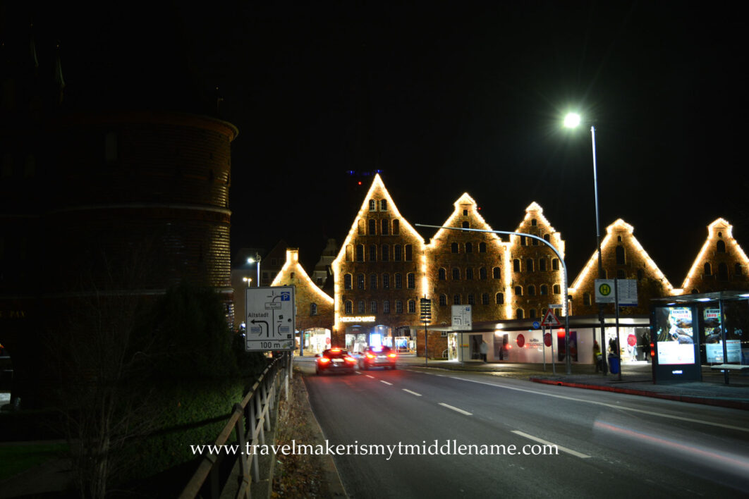 Night time: The streets of Lübeck next to the Holsten Gate by Christmas eve is completely without snow