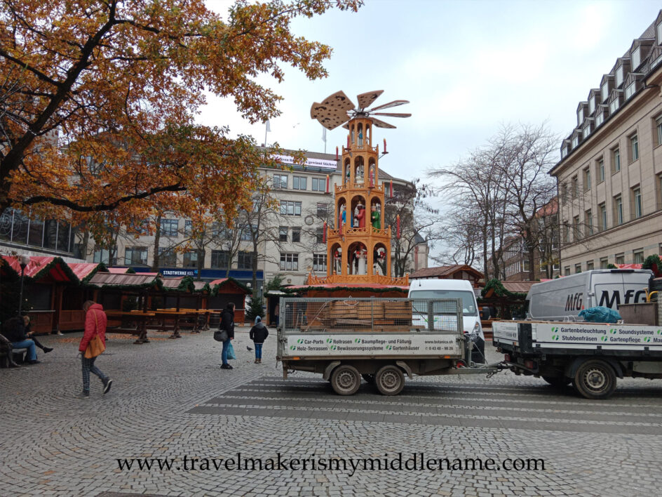 A trailer of parts for setting up a Christmas market stall during the day